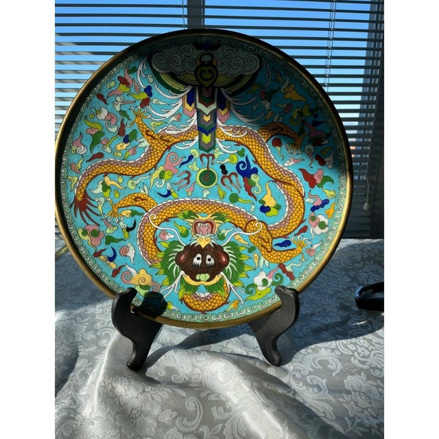A commanding antique Chinese cloisonné enamel charger from the Late Qing Dynasty to early Republic period. This 12-inch...