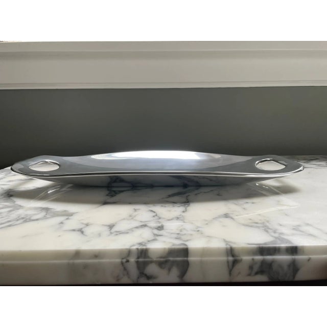 This sculptural tray is both a work of art and practical serving piece. This piece makes a statement in the home and when...