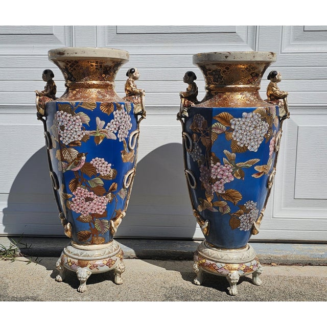This is a pair of Japanese Satsuma ware large floor vases, likely from the Meiji period or later, featuring a crackled...