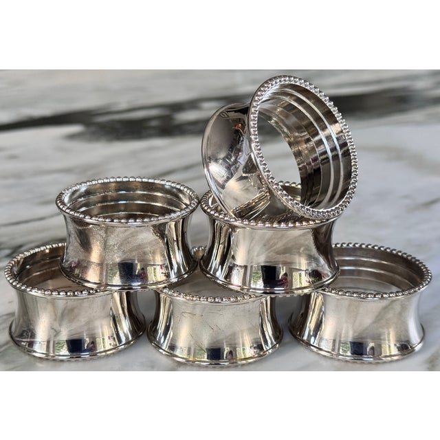 Presenting a set of 6 silver plated vintage napkin rings in a timeless style, featuring a beaded border. They will arrive...