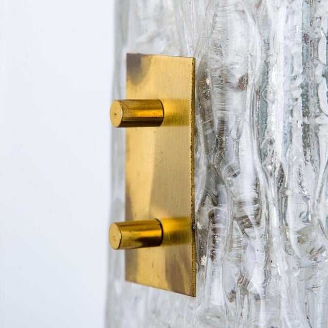 High-end wall sconces made of textured clear glass on a brass hardware. Designed and produced by j.t. Kalmar, austria in...