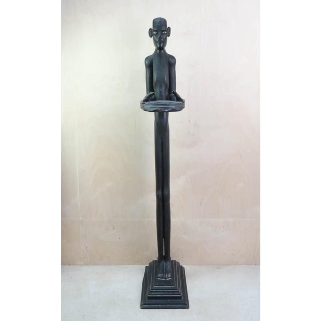 Wonderful stylized figure of a " bell boy " I particularly like the face Ebonized softwood with painted eyes Good...