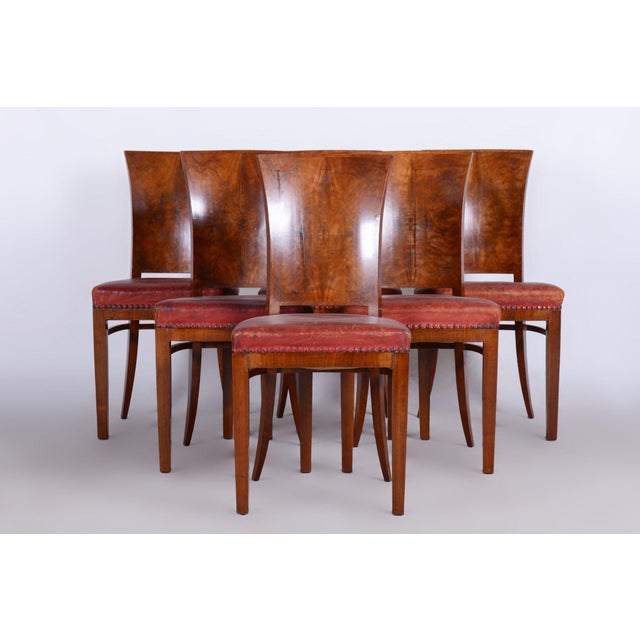 Six Art Deco chairs Origin: France Period: 1920-1929 Material: Walnut, red leather, original upholstery In pristine...