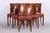 Six Art Deco chairs Origin: France Period: 1920-1929 Material: Walnut, red leather, original upholstery In pristine...