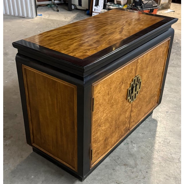 This is such a distinctive elegant cabinet. The classic Asian influenced brass hardware looks fantastic. The exquisite...