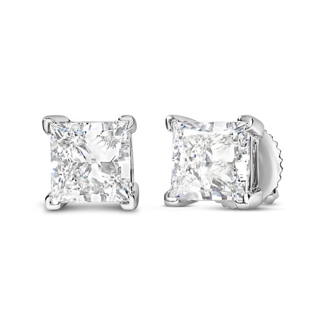 Embrace timeless elegance and modern sophistication with these exquisite 14K white gold solitaire stud earrings. Each...