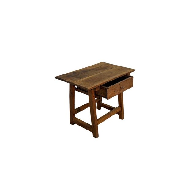 A 19th-century goat-shaped walnut sideboard, characterized by a rustic and functional structure, simple shapes, and...