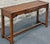 Very nice farmhouse style pine console table. Beautifully detailed raised panel molded top. Simple square legs with medial...