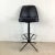 With its sturdy metal frame and tailored black vinyl upholstery, this vintage bar stool brings timeless industrial style...
