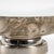 Be mesmerized by the swirls of the calacatta gold... Sitting atop an aluminum base with a polished nickel finish, cream,...