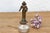 A beautifully cast micro-scale devotional figurine depicting a standing celestial attendant or deity, finished in a...