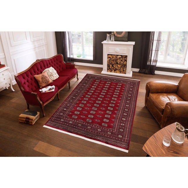 Transform the interior of your home with a beautiful hand-knotted Bokhara rug. Meticulously crafted with intricate...
