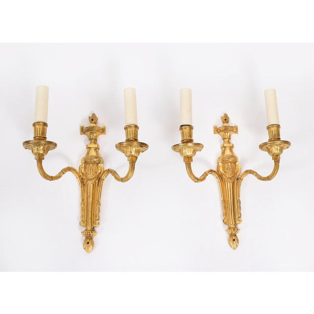 This is an elegant set of four antique French Louis Revival ormolu gilt wall-light sconces, C 1880 in date. Each wall-...