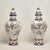Standout pair of large 19th century French faience earthenware lidded urns handcrafted in classic form featuring tassel...