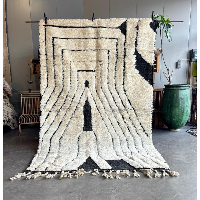 Bring timeless elegance into your home with this Moroccan Mrirt wool rug, handcrafted by skilled Berber artisans from the...
