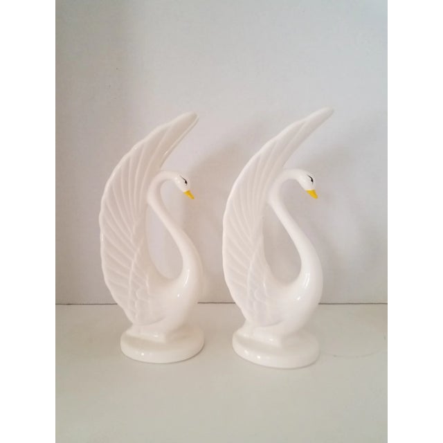 Vintage twin porcelain swan figurines from Taiwan. These swans are elegant and stunning. They would look awesome on a...
