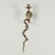 Standout pair of vintage Anglo Indian wall sconces crafted in brass in a stylized cobra snake form and decorated with red...
