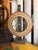 Vintage tabletop carnival game wheel featuring a hand-numbered wooden wheel and original metal star-spoke mechanism....