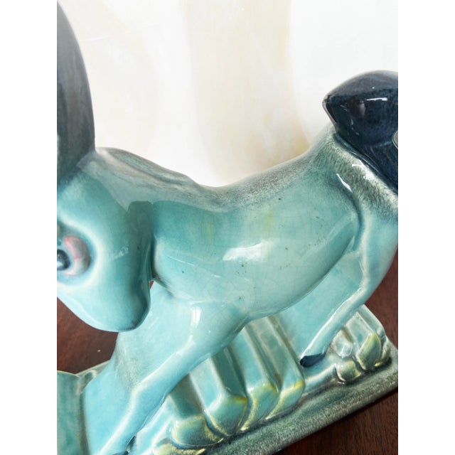 Add a touch of vintage charm to your decor with this exquisite Mid Century Modern Art Deco donkey figurine. Made by...