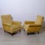 A pair of beautiful yellow fabric Bergere armchairs dating back to the 1960s and featuring typical conical wooden legs....