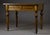Mid-19th century console or writing table, dated to circa 1850–1870, featuring a geometric parquetry top crafted from...