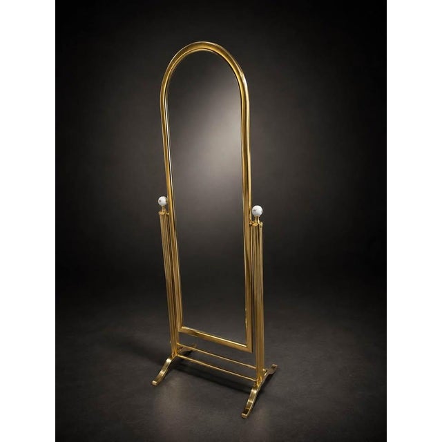 Elegant vintage Hollywood Regency–style freestanding cheval mirror featuring a polished brass-tone metal frame and tall...