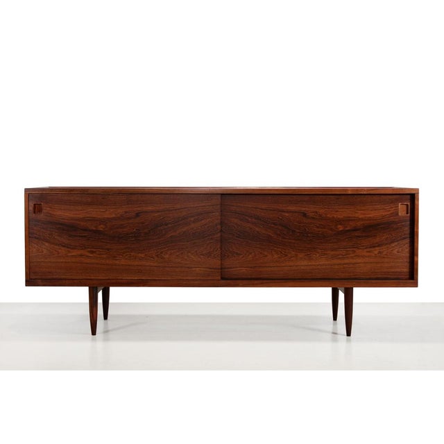 Rare sideboard of excellent quality. Designed by Niels Otto Møller for J. L. Møller Mobelfabrik in Denmark. This...