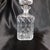 This is a cut crystal square decanter with a round, flat top stopper that may not be original, but it fits tightly and...