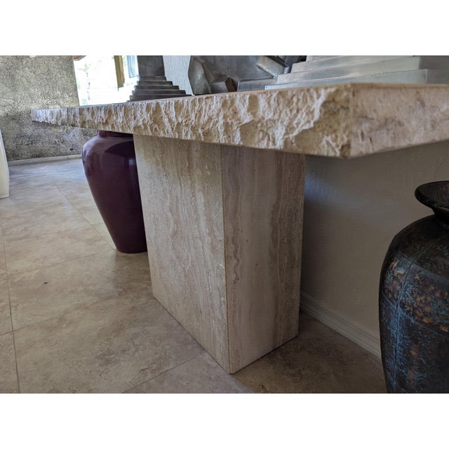 Postmodern Italian late 70's vintage travertine console table featuring a raw/chiseled edge. This modernist yet organic...