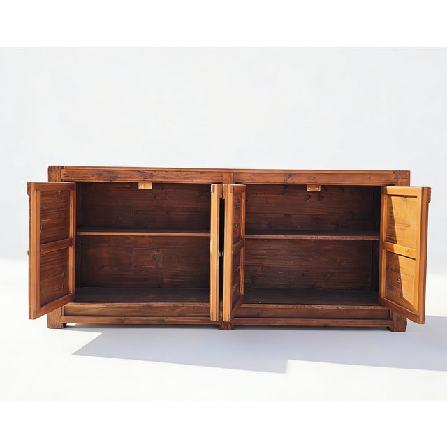 This 17th-century sideboard, originating from Shanxi Province, China, has been restored by local craftsmen to preserve its...