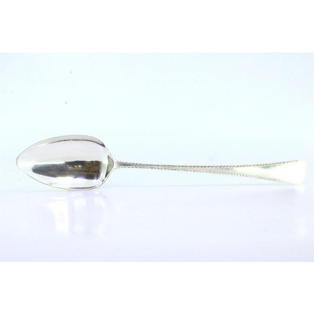 Silver Rice and Serving Spoon with Handle Grooves, in Very Good conditions. Designed 1920 to 1949 This piece has an...
