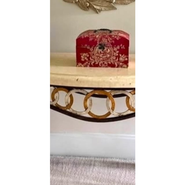 Elevate your entryway or living space with this striking Neoclassical-style console table by the prestigious, now-defunct...