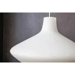 This Saturn opaline glass pendant is Scandinavian-designed. It features a chrome pendant with satin-finished opal...