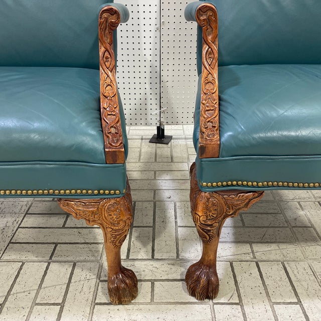 Beautiful blue leather Hancock and more style arm chairs. Beautifully hand carved fretwork on the arms and lions paws for...