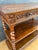 Antique carved oak console table featuring finely turned barley twist legs and rich floral carving to the apron. The piece...
