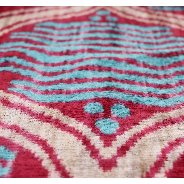 "Vibrant, expressive, and undeniably luxurious, this handmade Ikat lumbar pillow is designed to make a statement....