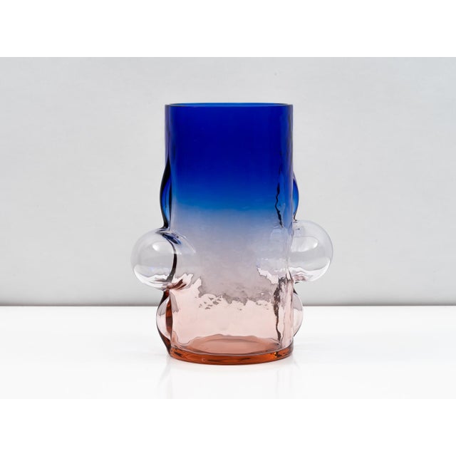 An exceptional vase designed by Toni Zuccheri for VeArt in 1988. The intensely-colored body transitions from purplish-pink...