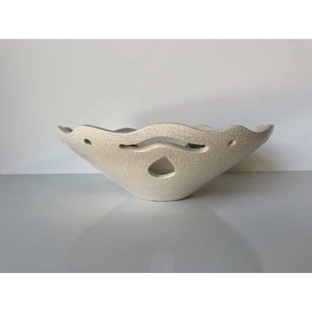 Charming and expressive, this 1980s vintage ceramic bowl by artist Betty is a unique example of handmade studio pottery...