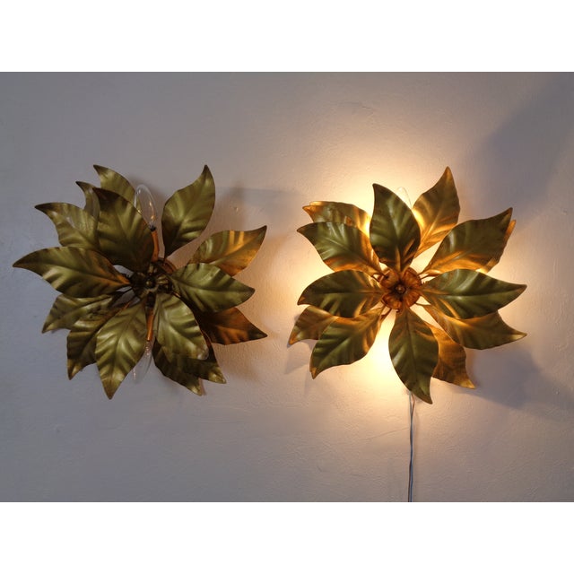 Pair of golden wall lamps with 4 burners each by Hans Kögl from the 1970s. I have official proof of authenticity such as...