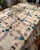 This Vintage Handmade Double Wedding Ring Quilt features a scalloped edge and measures 70” x 70”. Made from cotton with a...