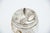 Cut and Gold-Painted Glass Bottle with a Silver Lid Featuring Embossed Floral Motifs, in Good conditions.