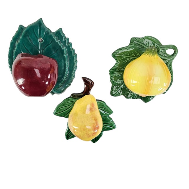 This vintage set of wall pockets are made of ceramic in pear, onion and apple shape. Their retro design and vibrant colors...