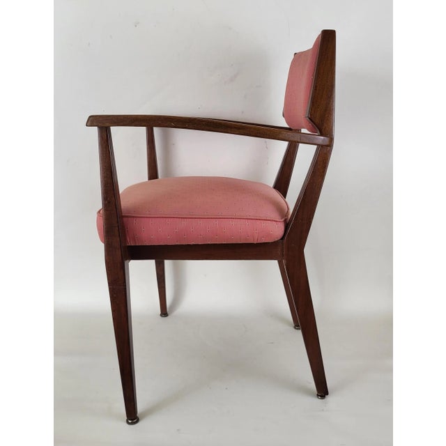 Rosewood armchair from the 1950s. In good condition with minimal traces of use and age. The fabric is original, without...