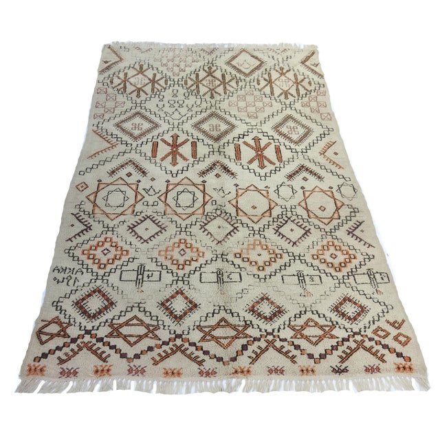 Rare antique Moroccan Beni Ourain rug handwoven in 1940. Depictions of WWII airplanes concurrent with the year as well as...
