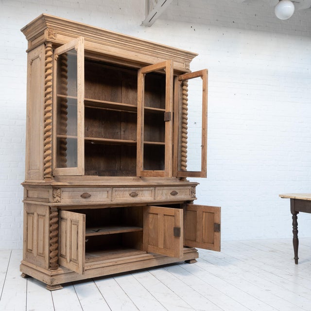 19th-century oak bookcase Comprising six lockable doors and three drawers. Disassembles into two parts. Raw oak. Antique...