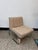 Elegant upholstered cantilever lounge chair dating from approximately the 1970s. The chair features a sculptural tubular...
