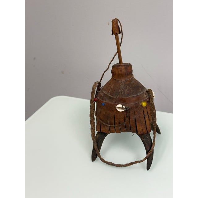 Design Plus Gallery presents a Vintage Handcrafted Nubian/Egyptian Leather Kohl Eyeliner Jar with Cowrie Shells. This...