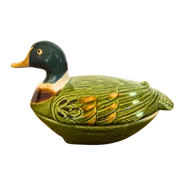 A wonderfully expressive French faience terrine in the form of a mallard duck, created for the renowned gourmet house...