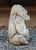 Mid-20th century cast stone seated gorilla garden ornament, English. He is a happy Silverback smiling with his banana in...