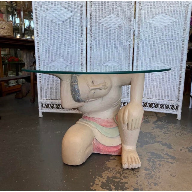 Hollywood Regency Vintage Balinese Kneeling Figure Sculptural Coffee Table With Round Glass Top | Hollywood Regency Exotic Figural Art Table For Sale - Image 3 of 8